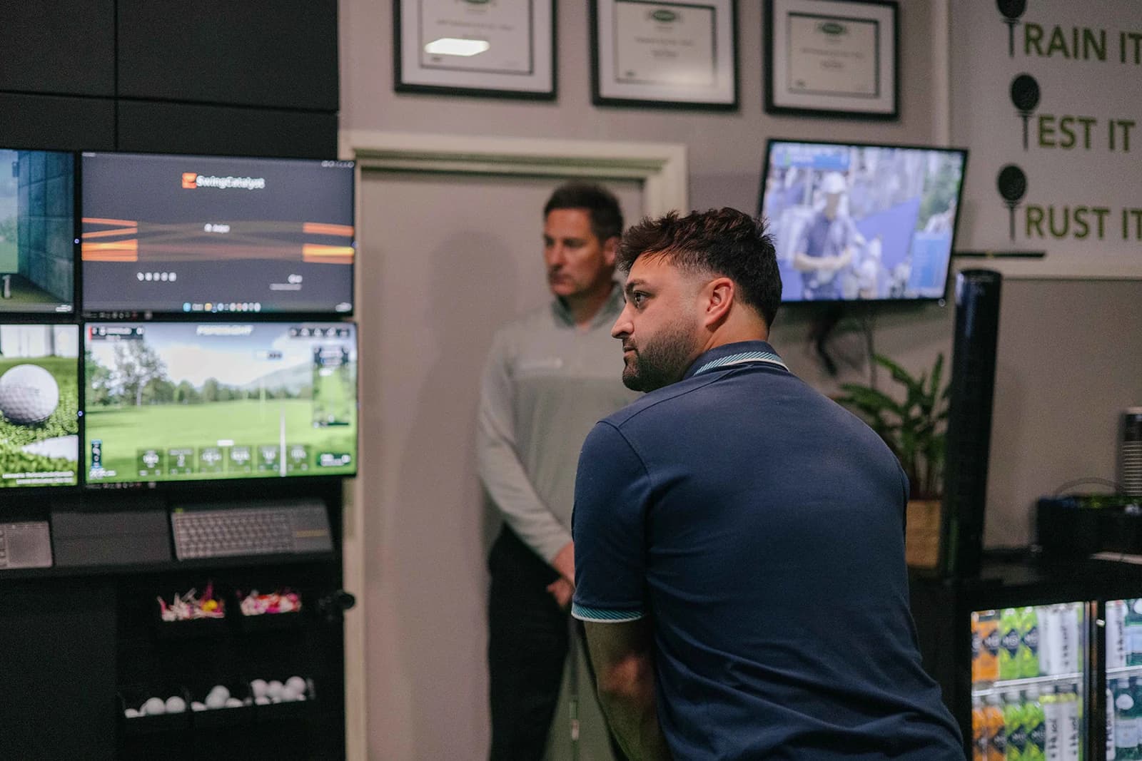 Reviewing swing video and data during a lesson